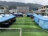 官方回应首批社会足球场用于赶集:春节临时使用,损坏已修复